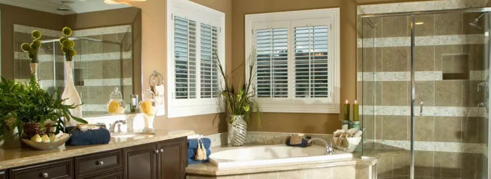 large master bath with soaker tub and wall in glass shower