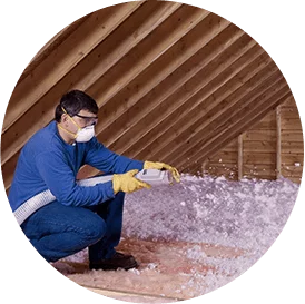 round image of contractor installing spray foam