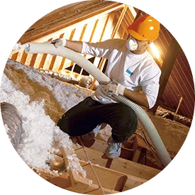 round image of contractor installing spray foam insulation