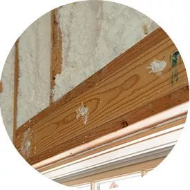 round image close up of wood beam and insulation
