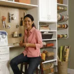 woman in garage with custom shelving unit for tool bench