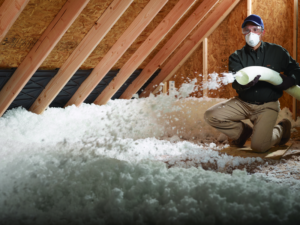 blown-in insulation being installed in an unfinished attic